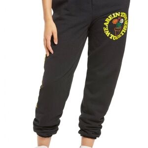 Petals and Peacock black Joggers with Yellow Graphic